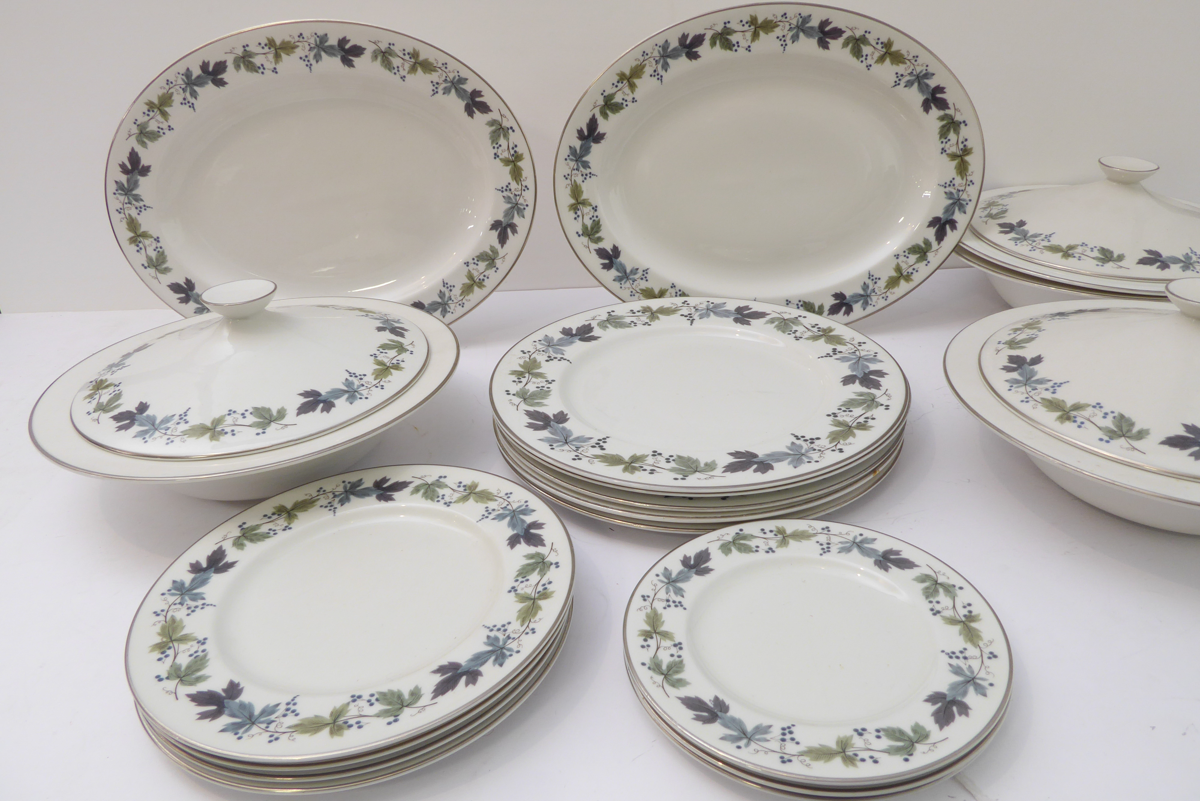 A Royal Doulton fine bone china part dinner service in the Burgundy pattern (T. C. 1001). The pieces