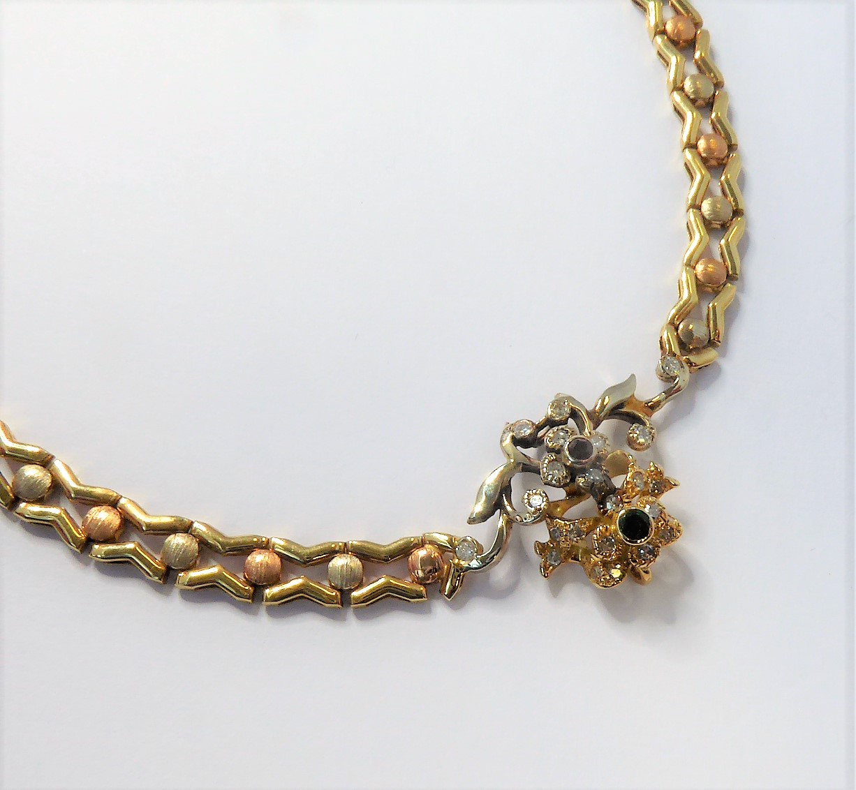 A 14-carat yellow gold (marked '585', Italy) openwork neck chain with an integral flowerhead style - Image 3 of 5