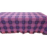 Large 20th century wool Welsh blanket, with geometric lattice squares design in purple, red, pink