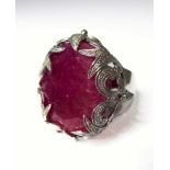 A heavy 18-carat white gold ring set with ruby and diamonds, ring size N