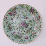 A 19th century Chinese celadon glazed porcelain dish: hand-decorated in famille rose enamels with