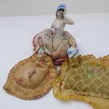 Three early 20th century porcelain and crinoline half-doll pincushions