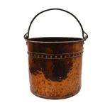 A 19th century cylindrical rivetted-copper coal bucket with iron swing-handle (35.5 cm diameter x
