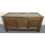 A large and heavy antique oak chest: three-panel top (later panels) opening to reveal right-hand