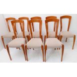 A set of eight designer stained-wood dining chairs: textured grey-leather-upholstered seats and