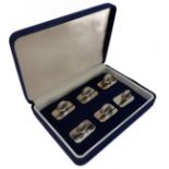 A cased set of six hallmarked silver menu-stands in the form of clam shells, Harrison Bros. &