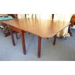A large mahogany gateleg dropleaf dining table on square legs (196 cm leaves up x 122 cm wide x 73