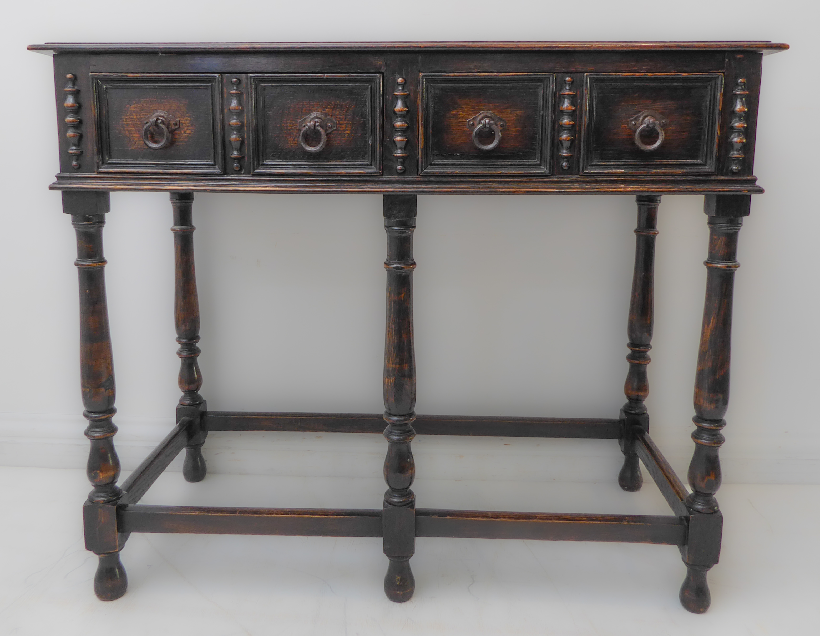 An early 20th century oak side table in late 17th century style: the moulded top above two half-