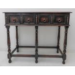 An early 20th century oak side table in late 17th century style: the moulded top above two half-