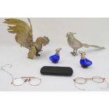 A silver-plated table centre modelled as a hen pheasant and another in brass as a rooster,