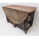 A large oval-topped double-gateleg drop-leaf table with single end-drawer; probably late 17th or