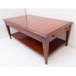 A good cherrywood coffee table by Multiyork: the slightly overhanging moulded top above two end-