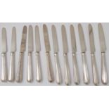 A set of eleven George III silver dessert knives, assayed London 1814, together with one other