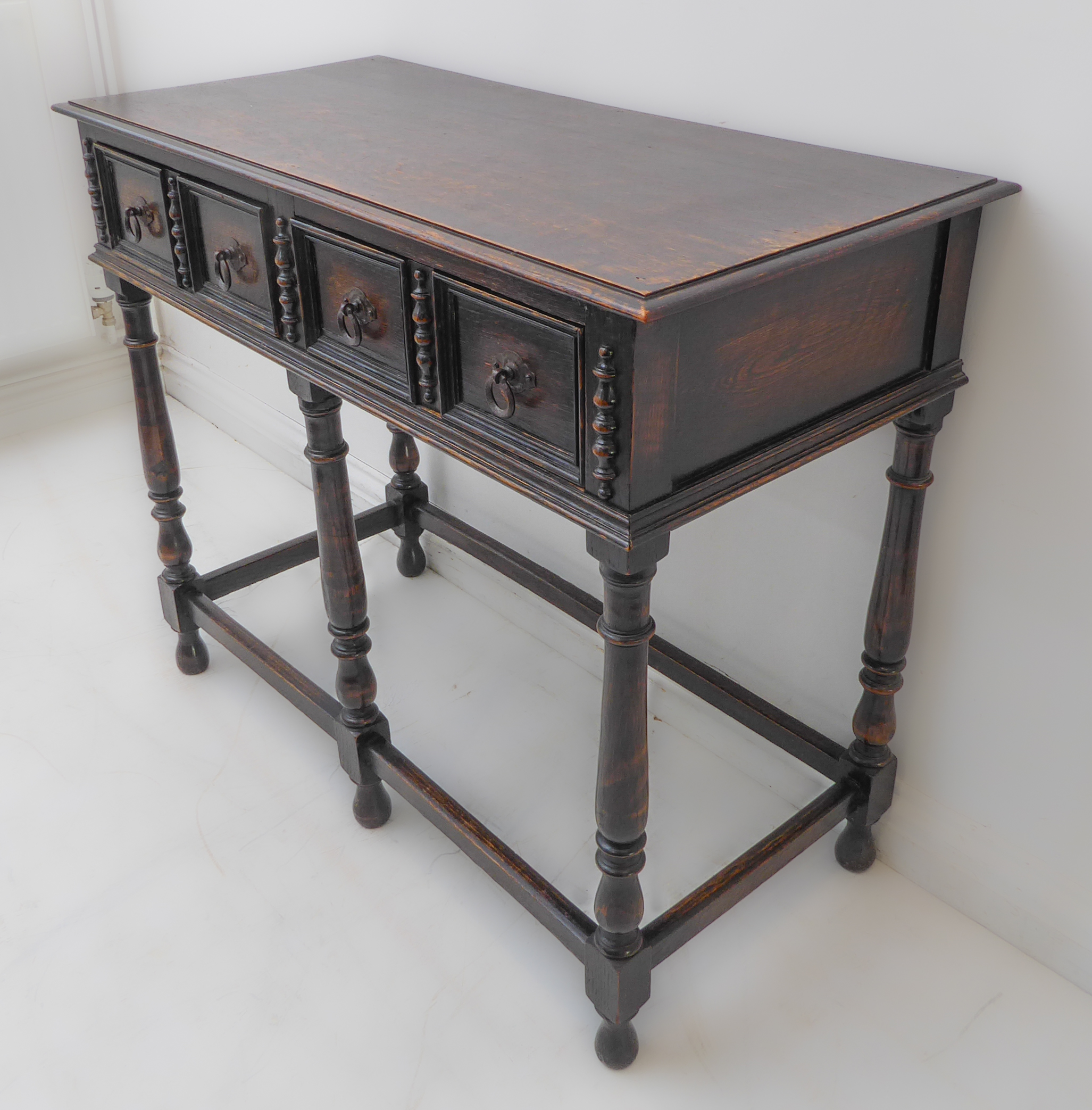 An early 20th century oak side table in late 17th century style: the moulded top above two half- - Image 2 of 5