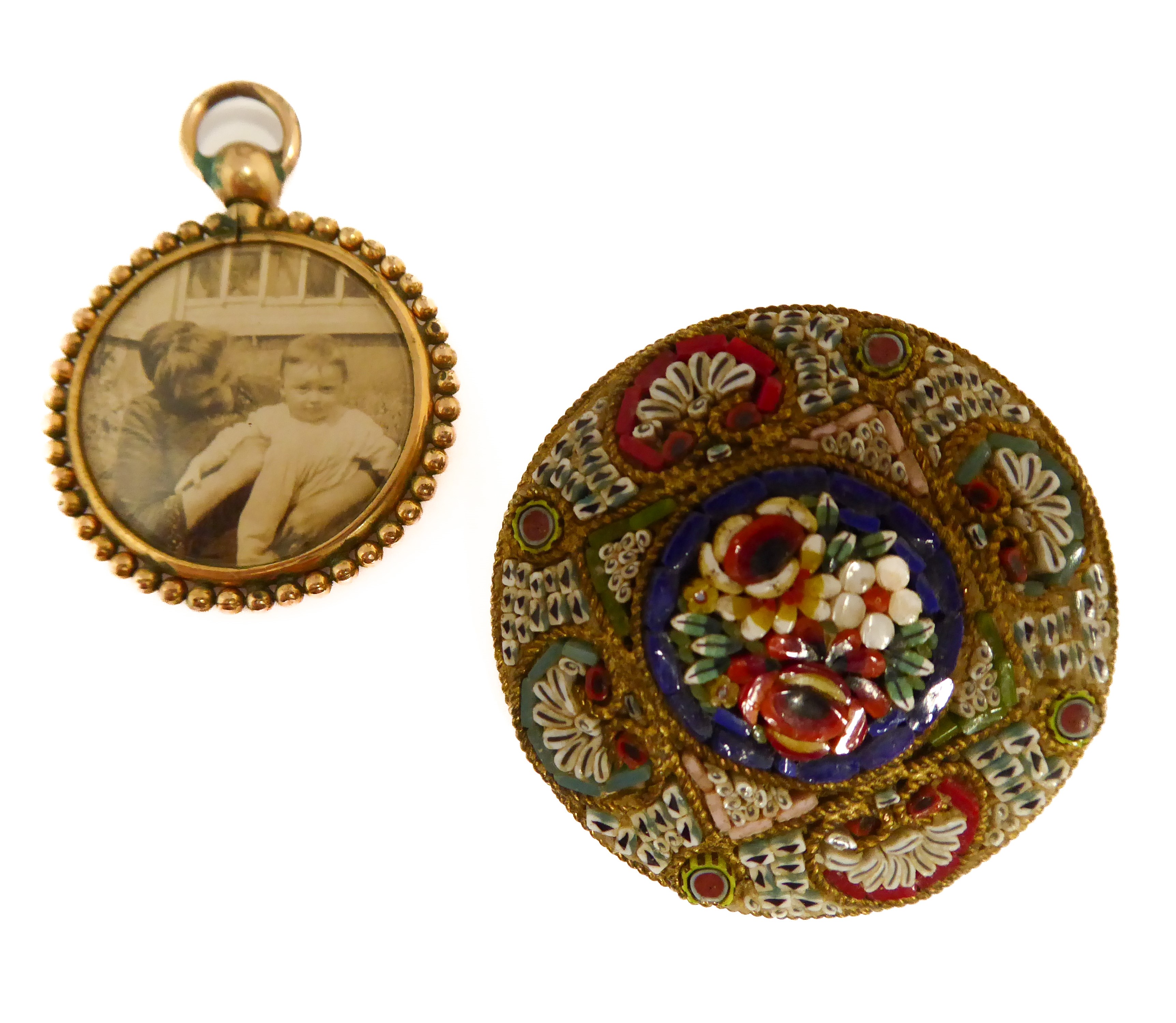 An unusual late 19th/early 20th century circular brooch pietra dura-set with various flowers,