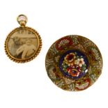 An unusual late 19th/early 20th century circular brooch pietra dura-set with various flowers,