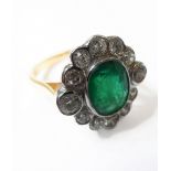 An 18-carat gold, emerald and diamond cluster ring, size O