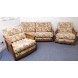 A good Ercol three-piece suite: two-seater sofa and two single armchairs; rich coloured elm and