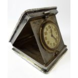 A fine early 20th century silver-cased travelling-clock: vacant square cartouche; engine-turned