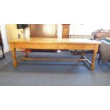A good late 19th century stained pine farmhouse-style kitchen table: the planked top above two end
