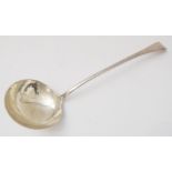 A George III period Old English pattern hallmarked silver soup ladle: engraved armorial crest;