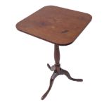 A George III period square tilt top mahogany, occasional table: turned stem and three downswept legs