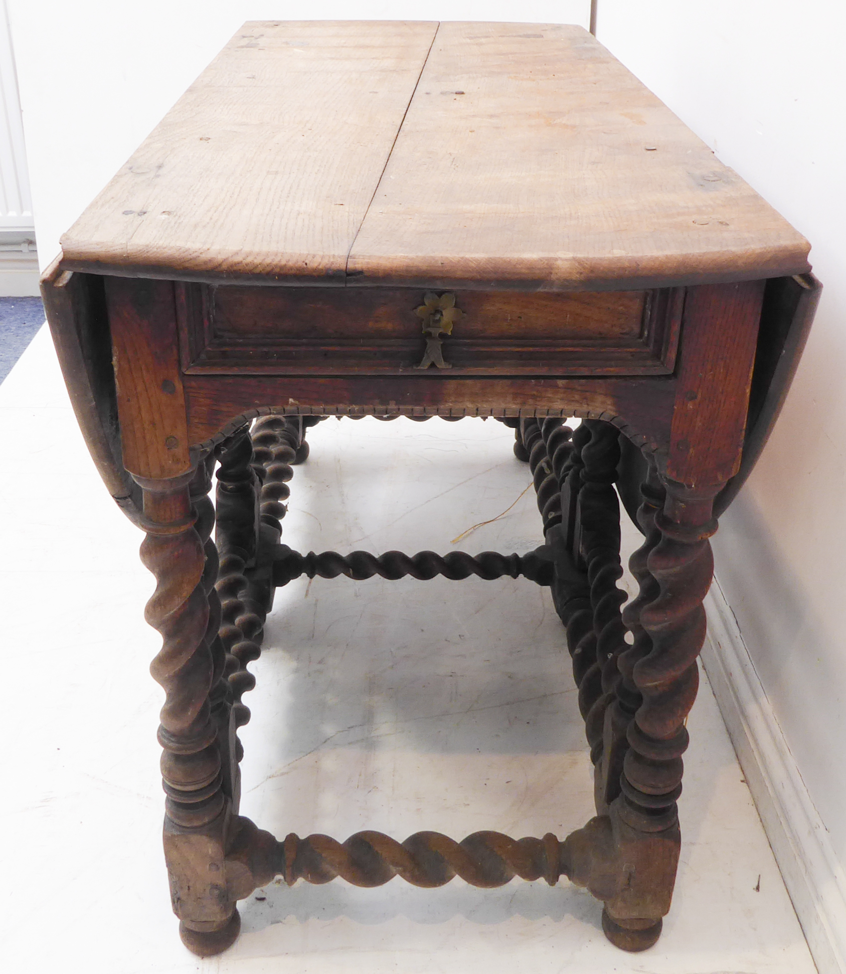 A large oval-topped double-gateleg drop-leaf table with single end-drawer; probably late 17th or - Image 2 of 6