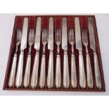 A set of six hallmarked-silver-bladed tea knives and forks assayed London (probably 1836), within