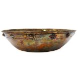 A hallmarked silver-gilt bowl: the border decorated with small crosses and spheres in low relief (