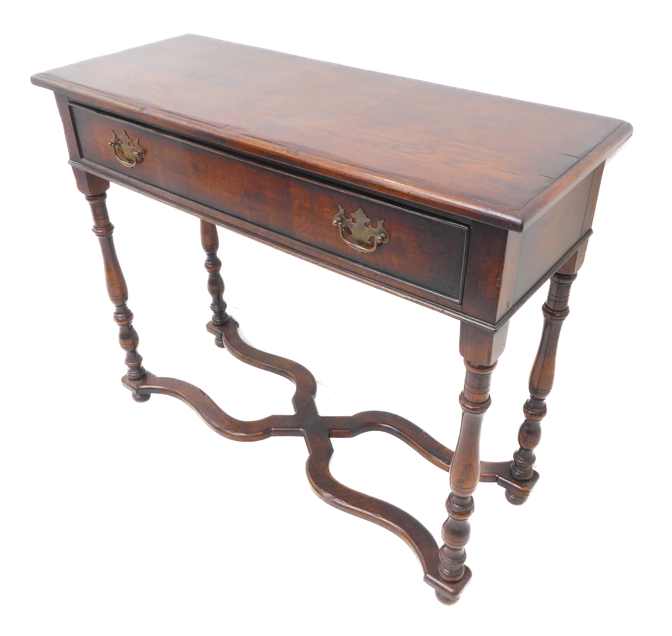 A good reproduction solid oak side-table: moulded top above a single full-width drawer with brass