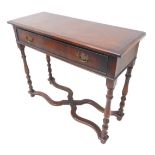 A good reproduction solid oak side-table: moulded top above a single full-width drawer with brass