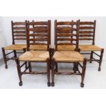 A good set of six solid oak and rush-seated ladderback chairs in early style (reproduction)