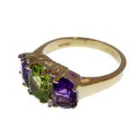 A 9-carat gold suffragette style ring set with amethysts, peridots and diamonds