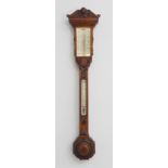 A fine 19th century carved-oak-cased barometer: ornate classical-style carved angular pediment