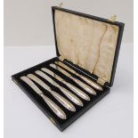 A cased set of six silver-handled butter knives