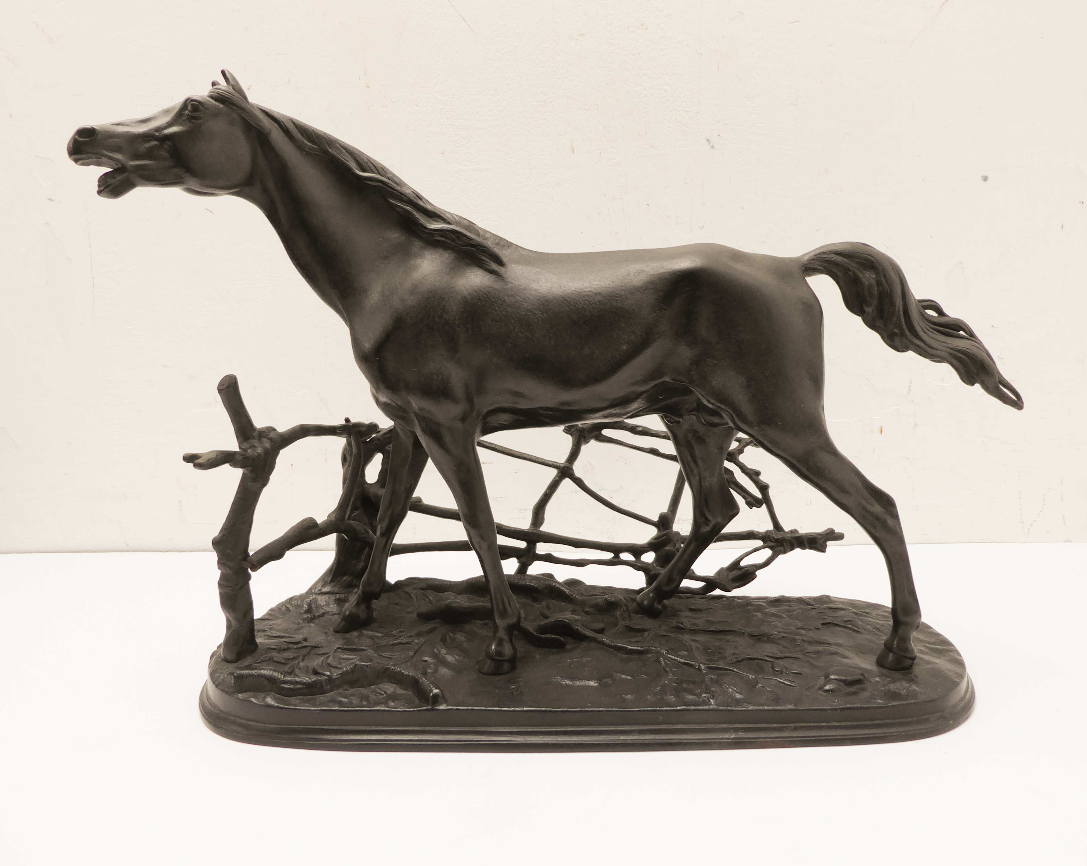 A cast-iron Russian model model of a stallion within a branch fence (dated 1969 to the underside) (