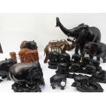 A variety of carved wood, ornamental and decorative elephants