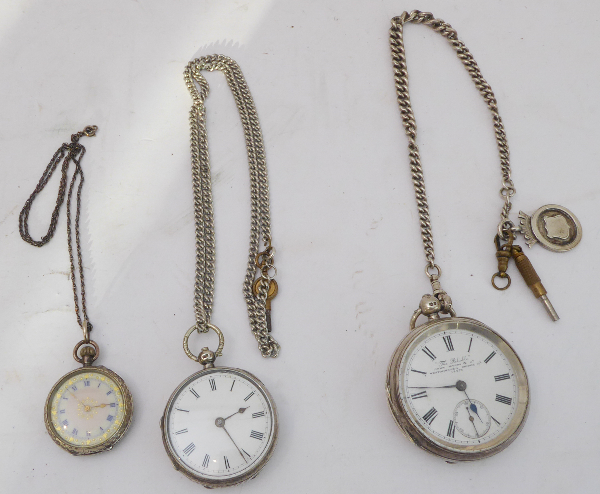 Three open-faced pocket watches: a large gentleman's example marked 'The Reliable: John Myers &