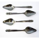 A set of four Georg Jensen hallmarked silver grapefruit spoons, marked 925 Denmark and with other