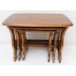 A nest of three Ercol elm occasional tables (the largest 57cm wide x 35.5cm deep x 43cm high)