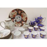 Two Japanese porcelain coffee services and a large 19th century Japanese Imari charger 1. A good