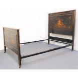 An early 20th century lacquered double bedstead decorated with chinoiseries and comprising