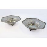 A pair of pierced hallmarked silver bonbon dishes of hexagonal form and on three legs, assayed