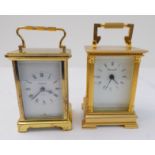 A modern gilt-metal carriage clock with white enamel dial with Roman numerals signed 'Churchill' and