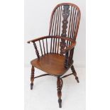 A mid-19th century comb-back Windsor armchair of good colour and large proportions: yew wood bows