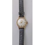A lady's 9-carat yellow-gold-cased dress wristwatch: the off-white dial signed 'Omega' and with