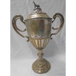 SILVER 2-HANDLED LIDDED TROPHY, THE LID SURMOUNTED WITH A HORSE BY GM&S BIRMINGHAM 1910 - 49CM TALL,