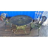 PAINTED WROUGHT METAL CIRCULAR GARDEN TABLE AND PAIR OF MATCHING OPEN ARMCHAIRS.