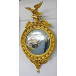 EARLY 20TH CENTURY GILT FRAMED CIRCULAR CONVEX MIRROR SURMOUNTED BY AN EAGLE 116CM TALL X 61CM WIDE