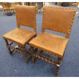 PAIR OF LATE 19TH OR EARLY 20TH CENTURY OAK HALL CHAIRS WITH BARLEY TWIST SUPPORTS & LEATHER